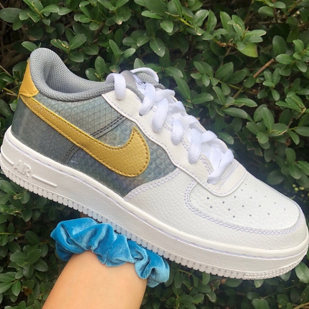 Nike Sneakers with Gold and White Design